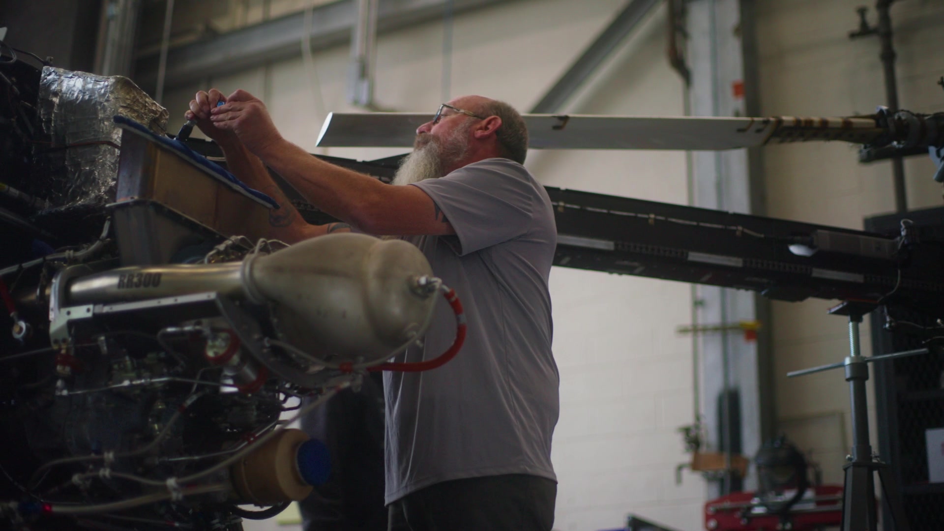 Kaman KARGO mechanic at work in the hangar