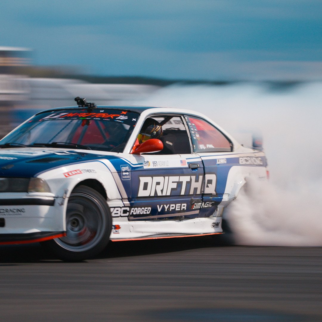 Adam LZ drifting through tire smoke at the LZ World Tour