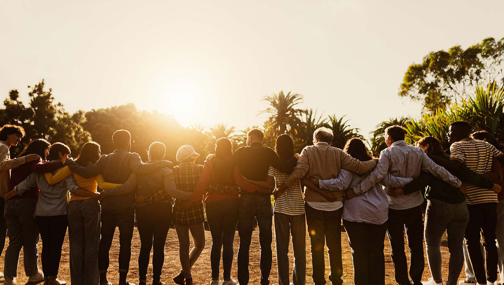 Photo of a group of people coming together, forming a community