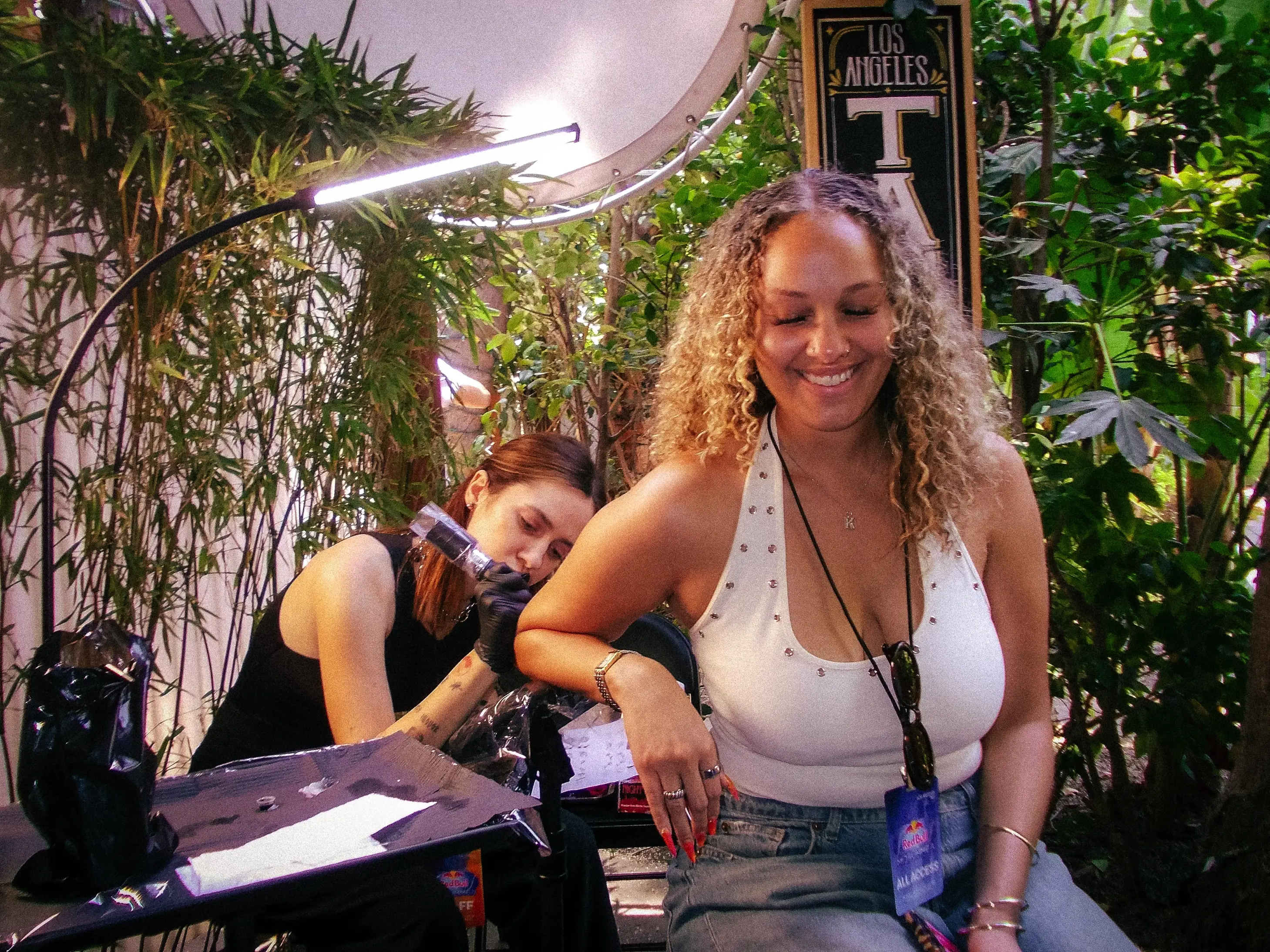 Guests receiving temporary tattoos at the Red Bull Midsummer brand activation.