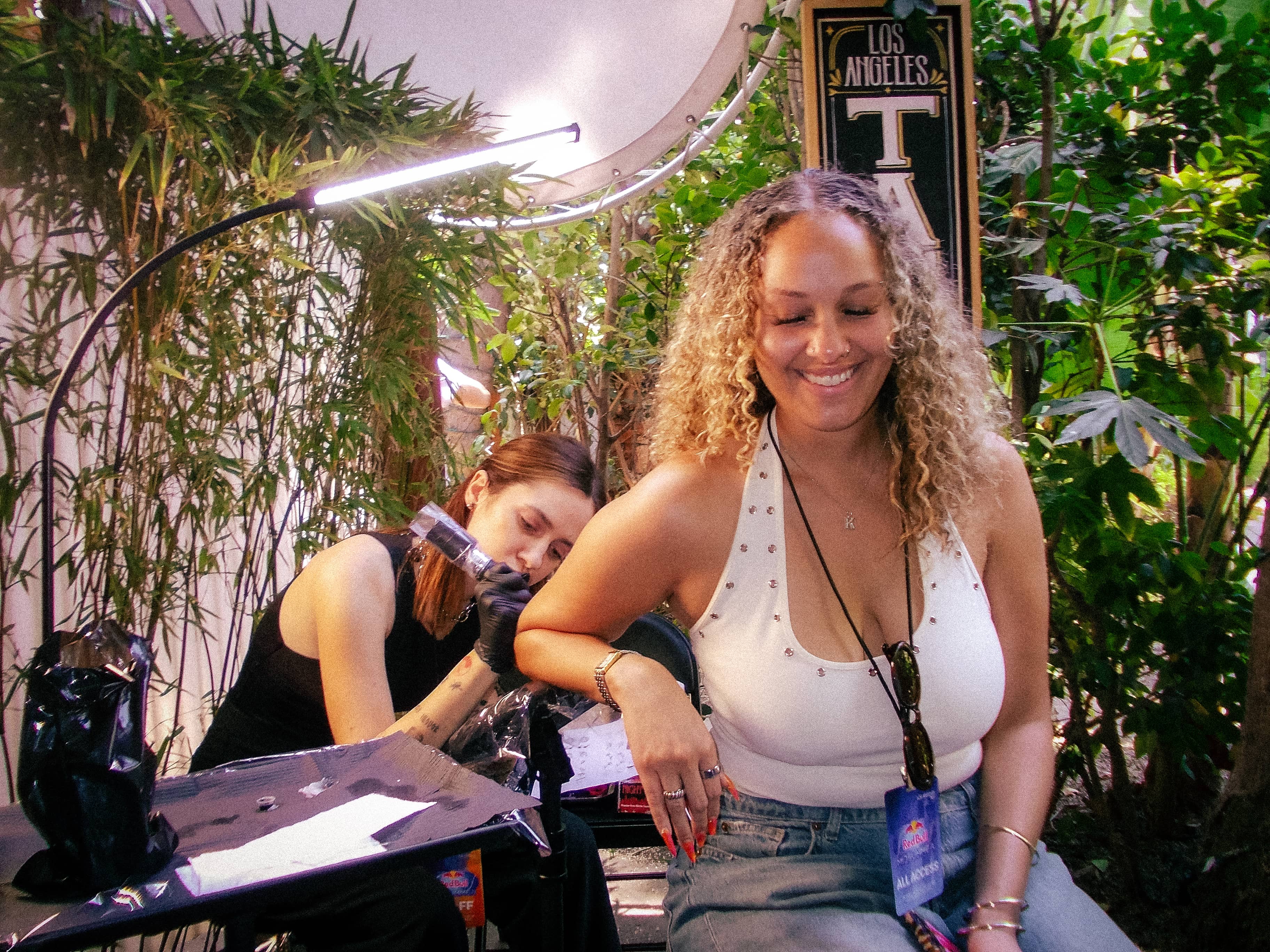 Guests receiving temporary tattoos at the Red Bull Midsummer brand activation.
