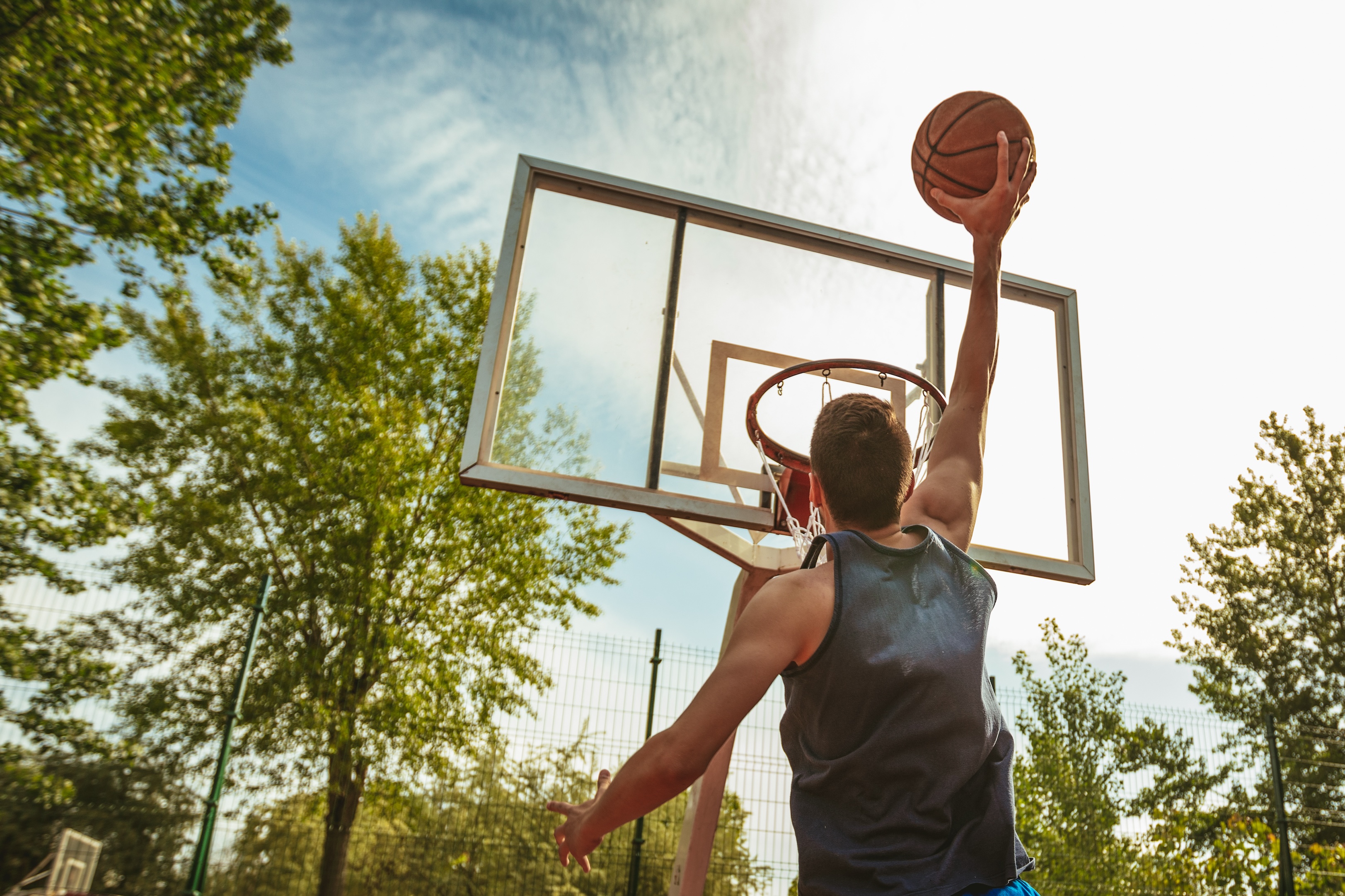 Man dunking the basketball stock image