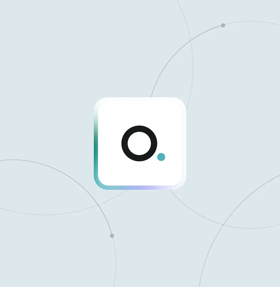 White rounded square key with a black letter O and a small teal dot on its lower right corner on a light gray background with faint circular lines.