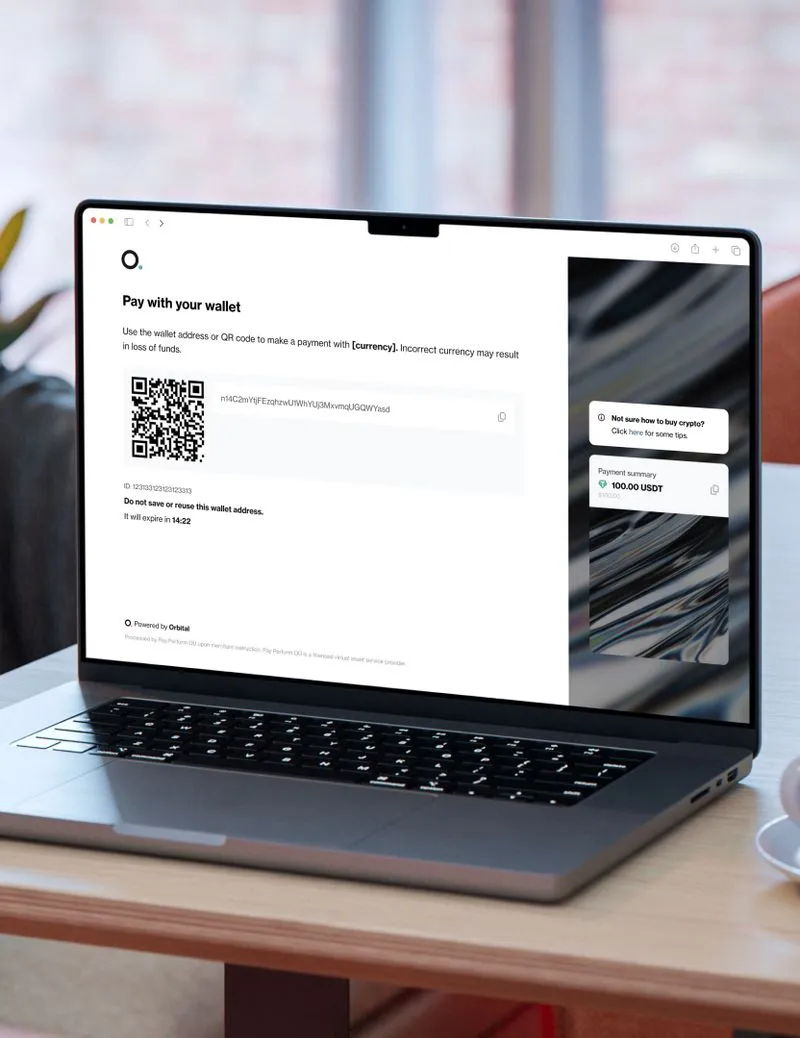 Laptop screen displaying a crypto payment page with a QR code, wallet address, and payment summary for 100.00 USDT.