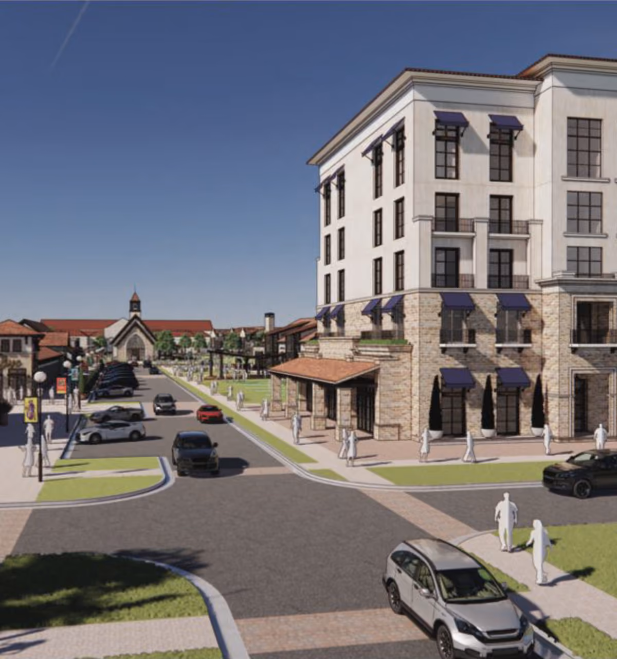 Street view of cars, pedestrians, and buildings including a large multi-story corner building and a church in the distance.