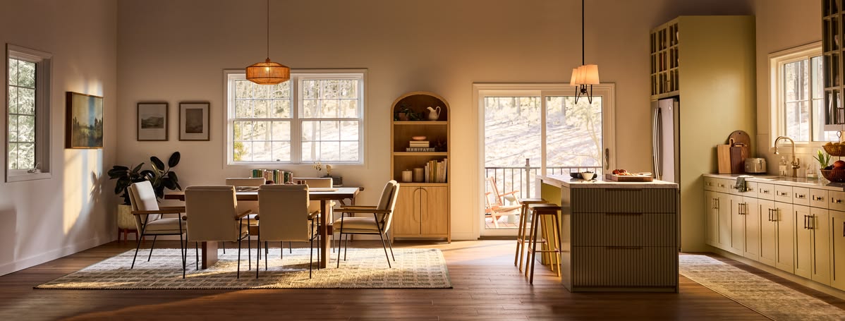 Bright dining room and kitchen with large replacement windows
