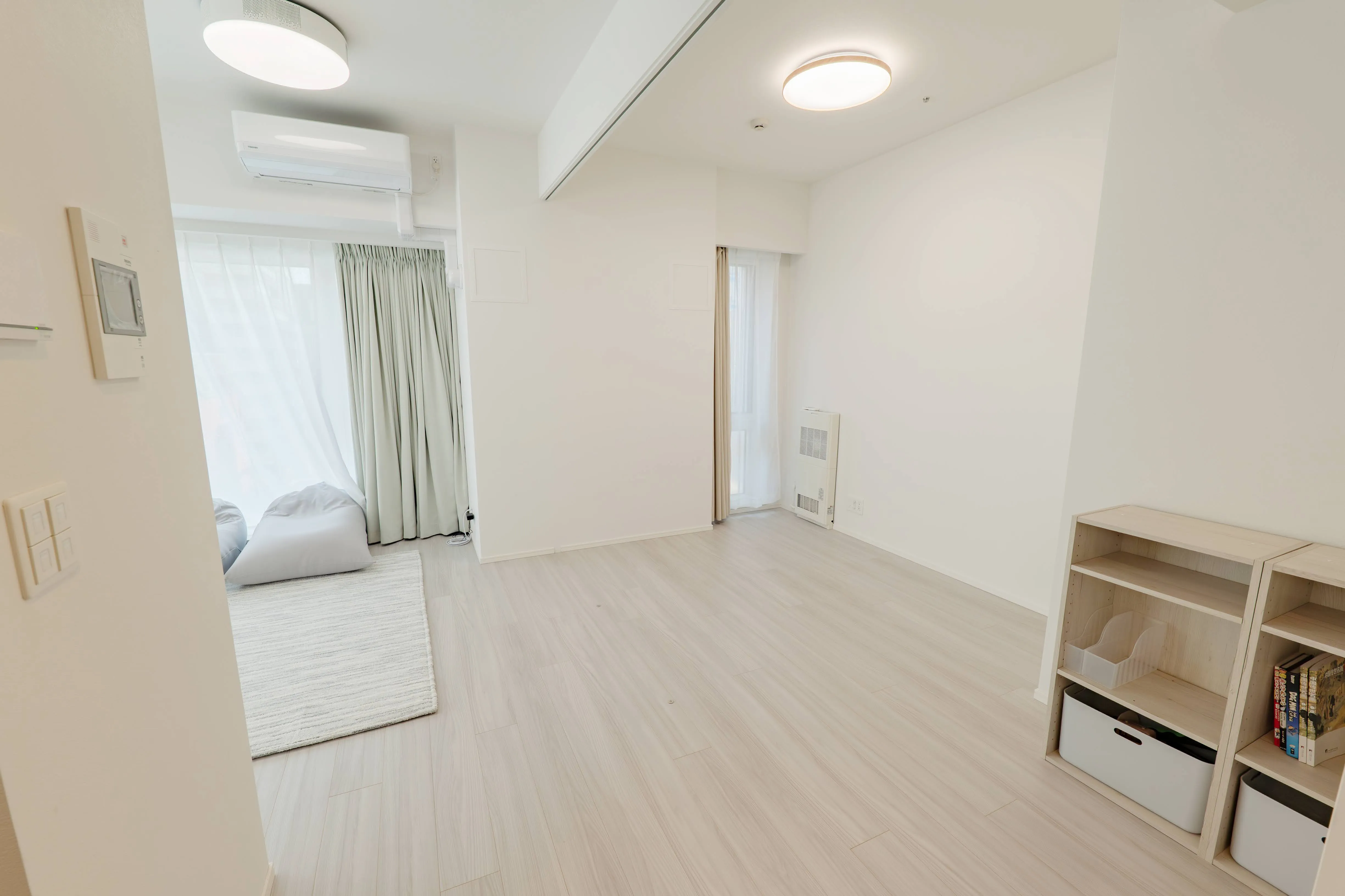 Living room of Room 911 at ONE Sapporo Station Tower.