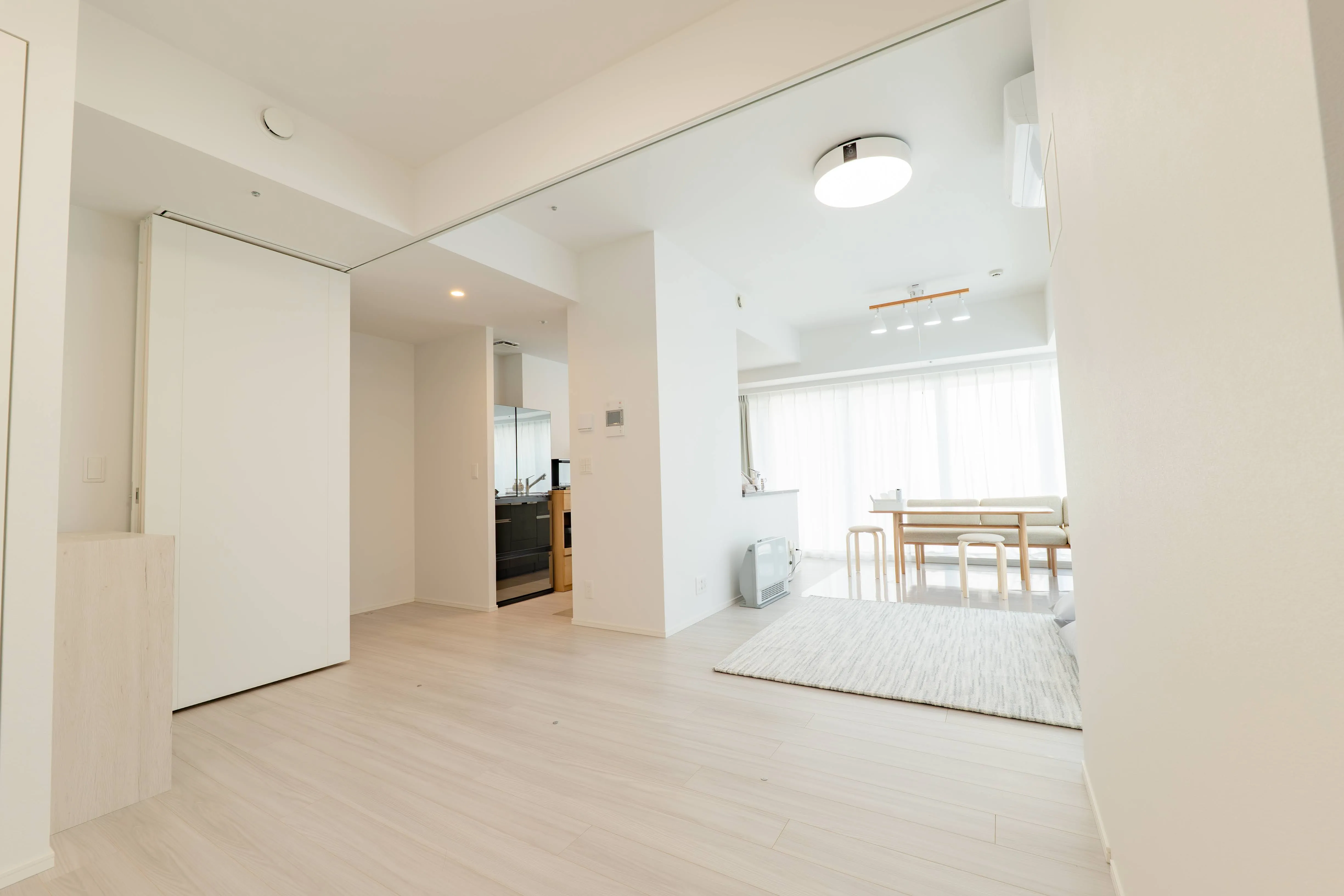 Living room of Room 911 at ONE Sapporo Station Tower.