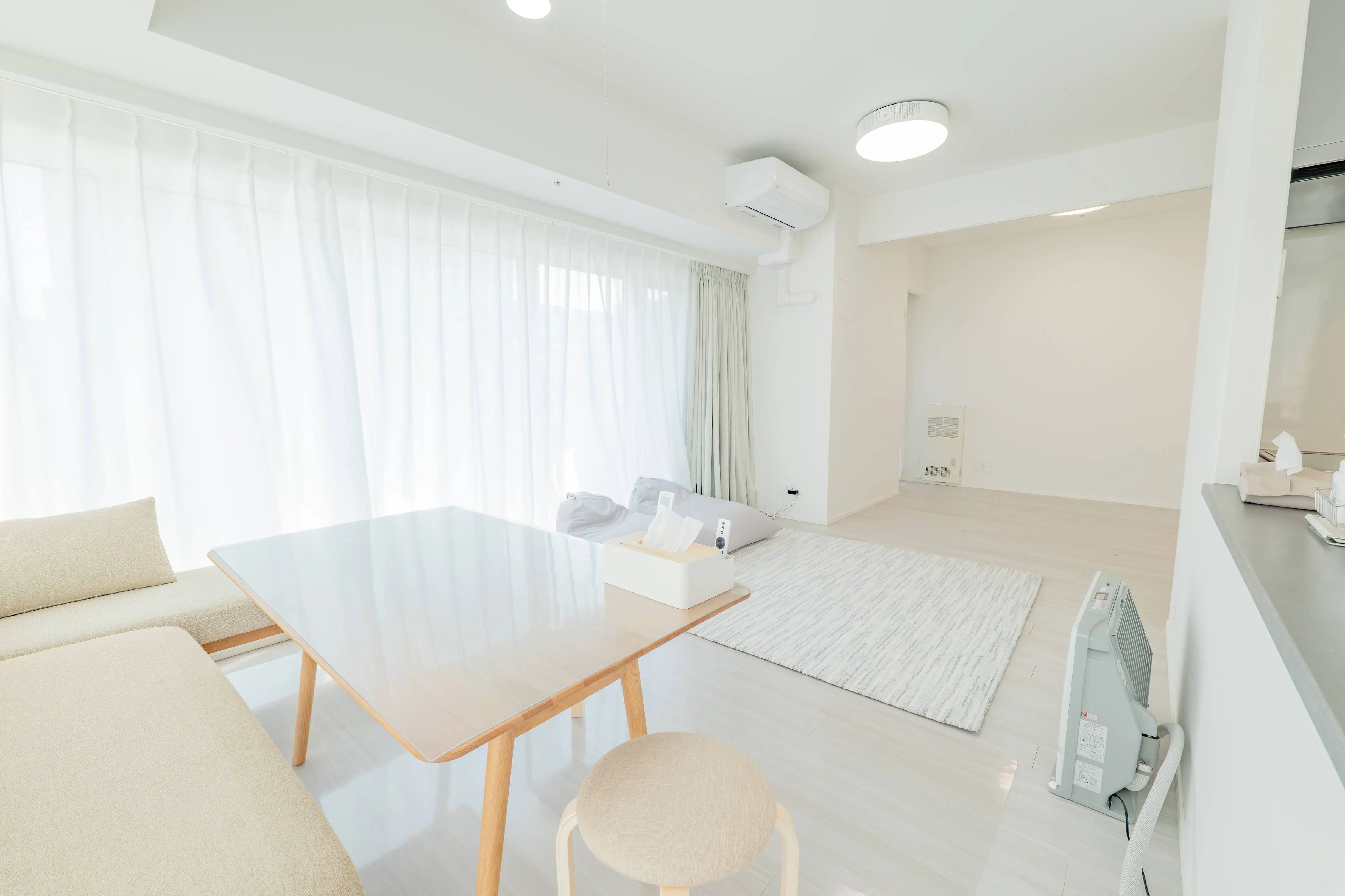 Living room of Room 911 at ONE Sapporo Station Tower.