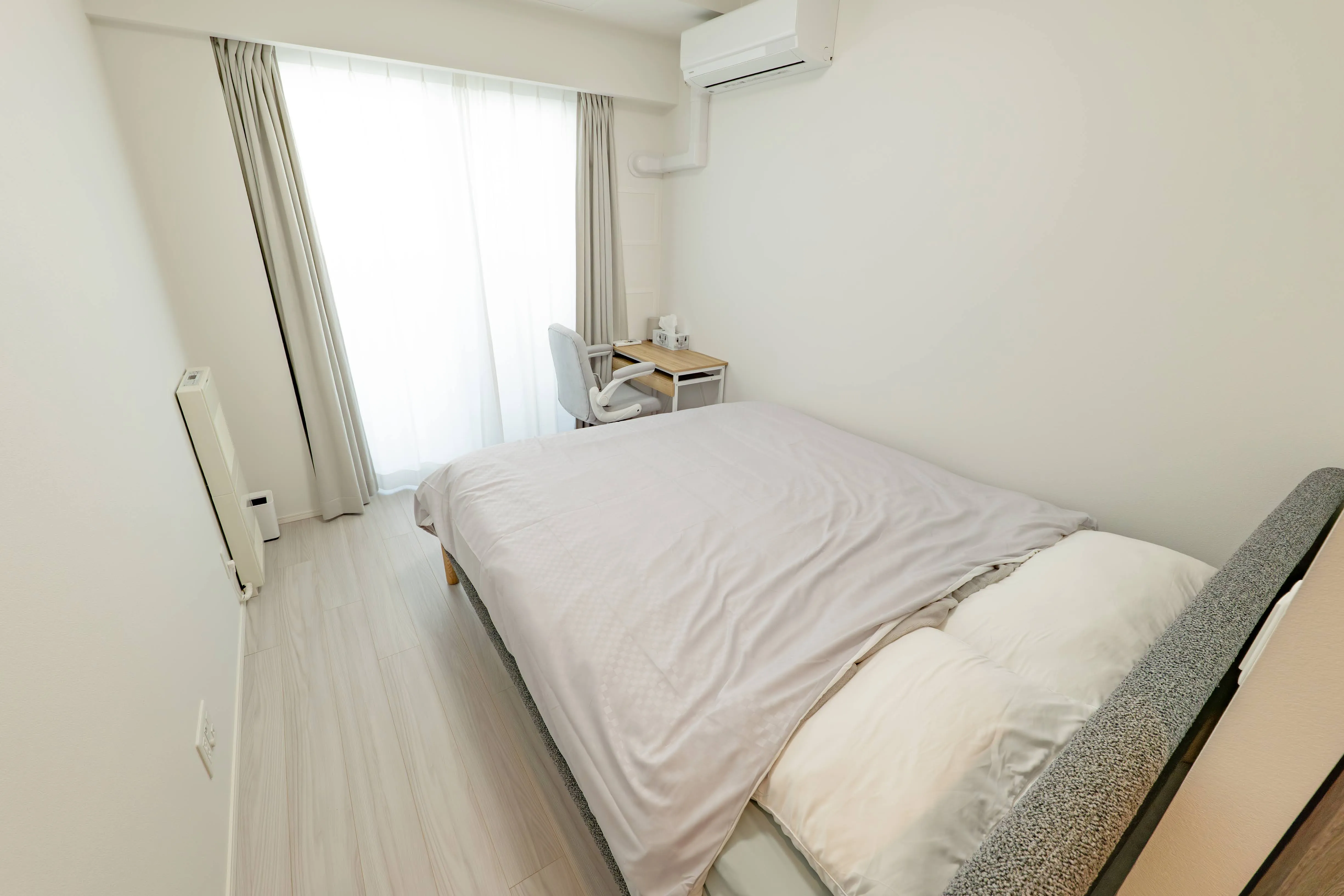 Bedroom of Room 911 at ONE Sapporo Station Tower.