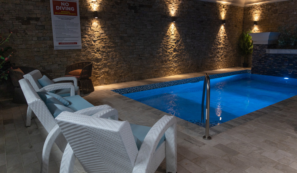Golden Apple Suites pool and outdoor lounge