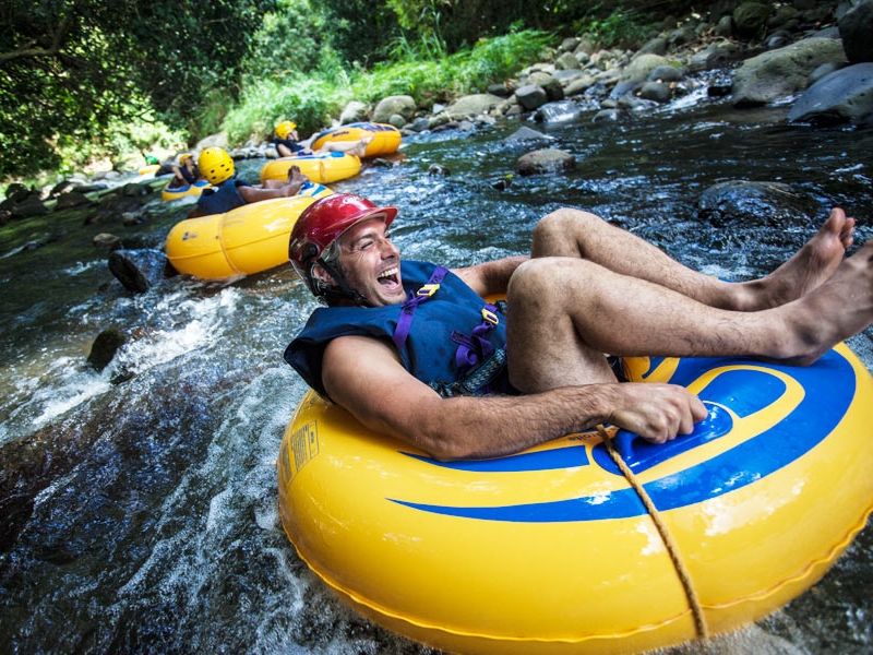 Guests tubing through a Grenada river