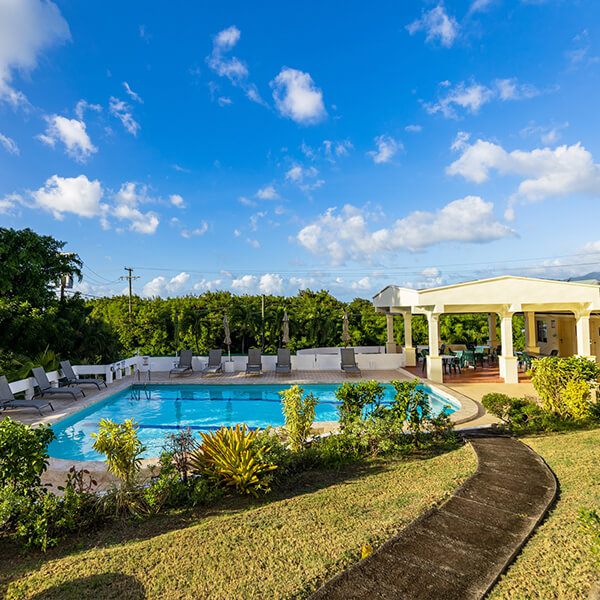Siesta Hotel swimming pool and tropical grounds