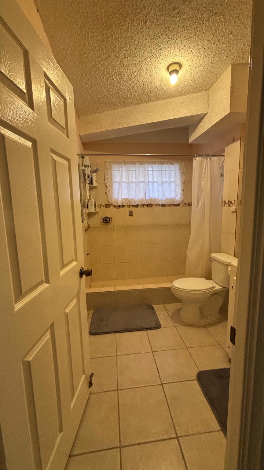 Ginger Court I large tiled bathroom with walk-in shower