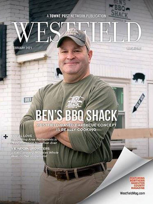 A man wearing a hat and a green shirt is on the cover of Westfield Magazine.