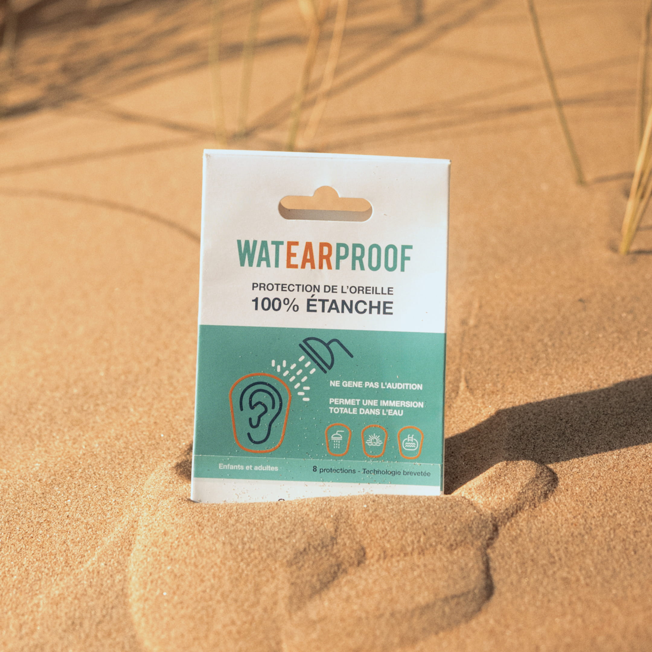 Pack WatEARproof posé sur le sable
