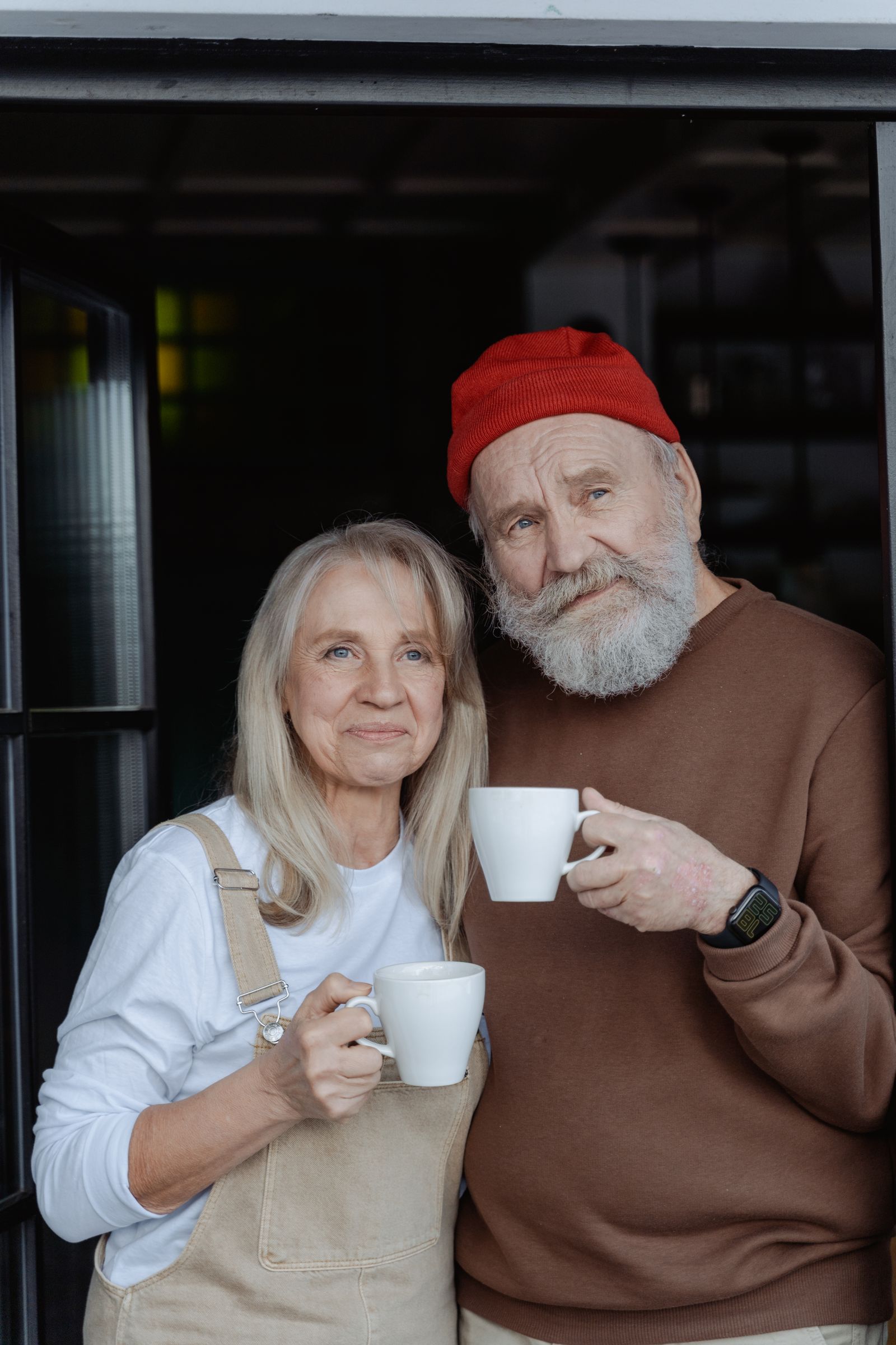 A retired couple enjoying coffee together at home