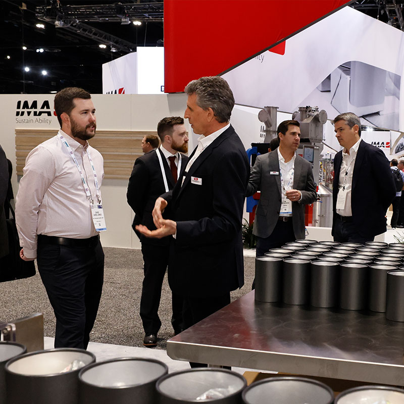Image of industry leaders at a PMMI Media Group event

