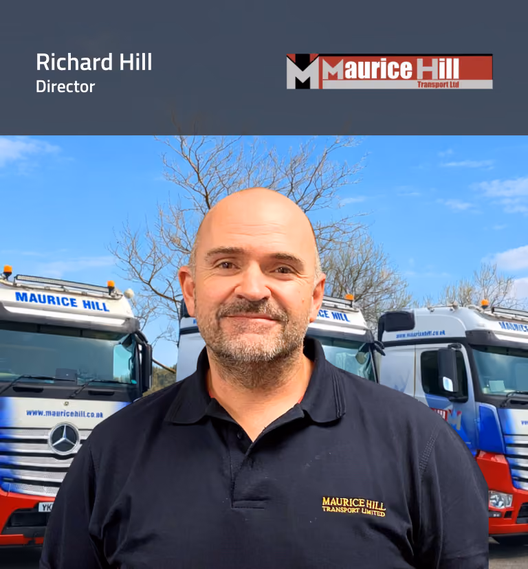 Richard Hill, Director of Maurice Hill Transport Ltd, standing in front of company trucks at the fleet depot