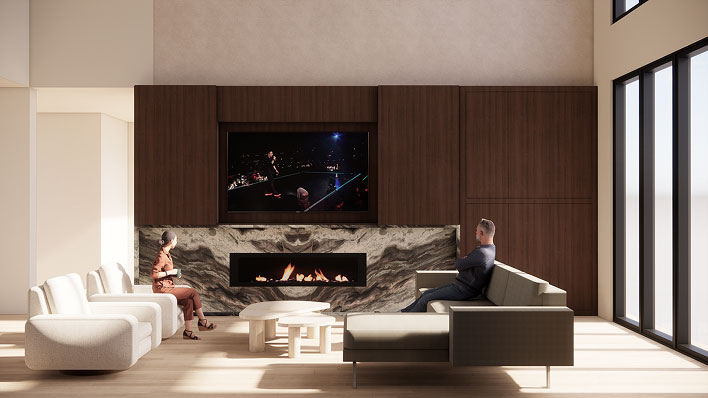 Modern living room with a fireplace, TV above, marble accent wall, and seating with two people watching TV.