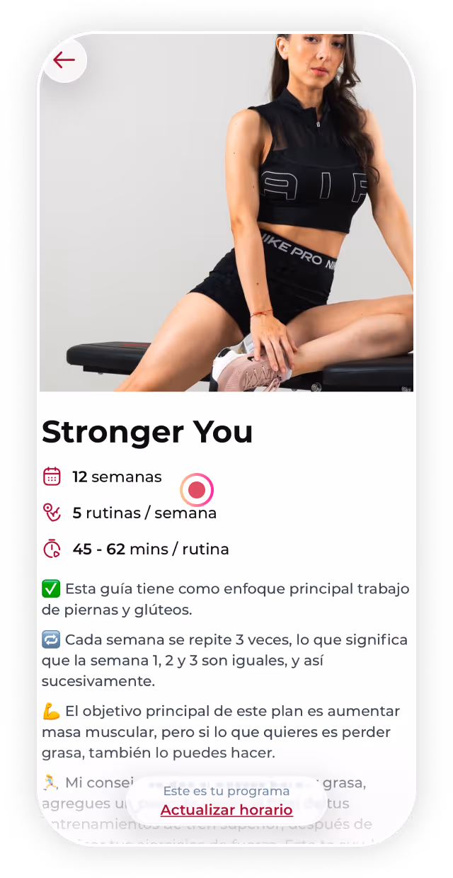 Fit woman in black workout clothes sitting on gym bench stretching leg, fitness app screen below.