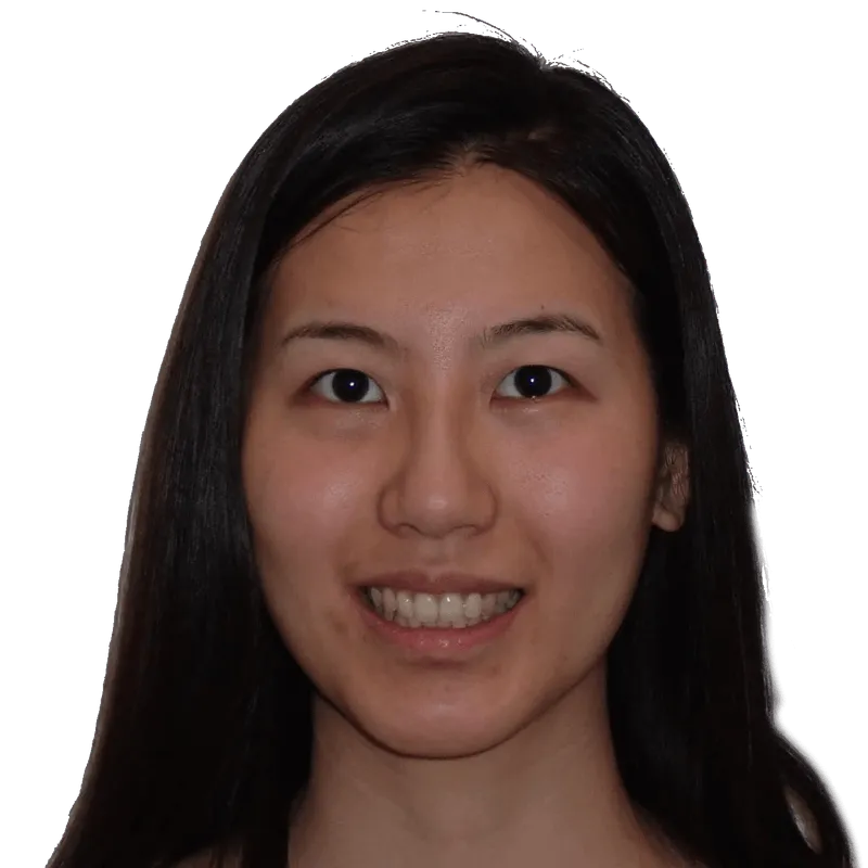 Smiling woman with long black hair against a solid muted teal background.