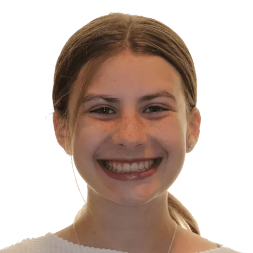 Smiling young woman with brown hair tied back and wearing a white top.