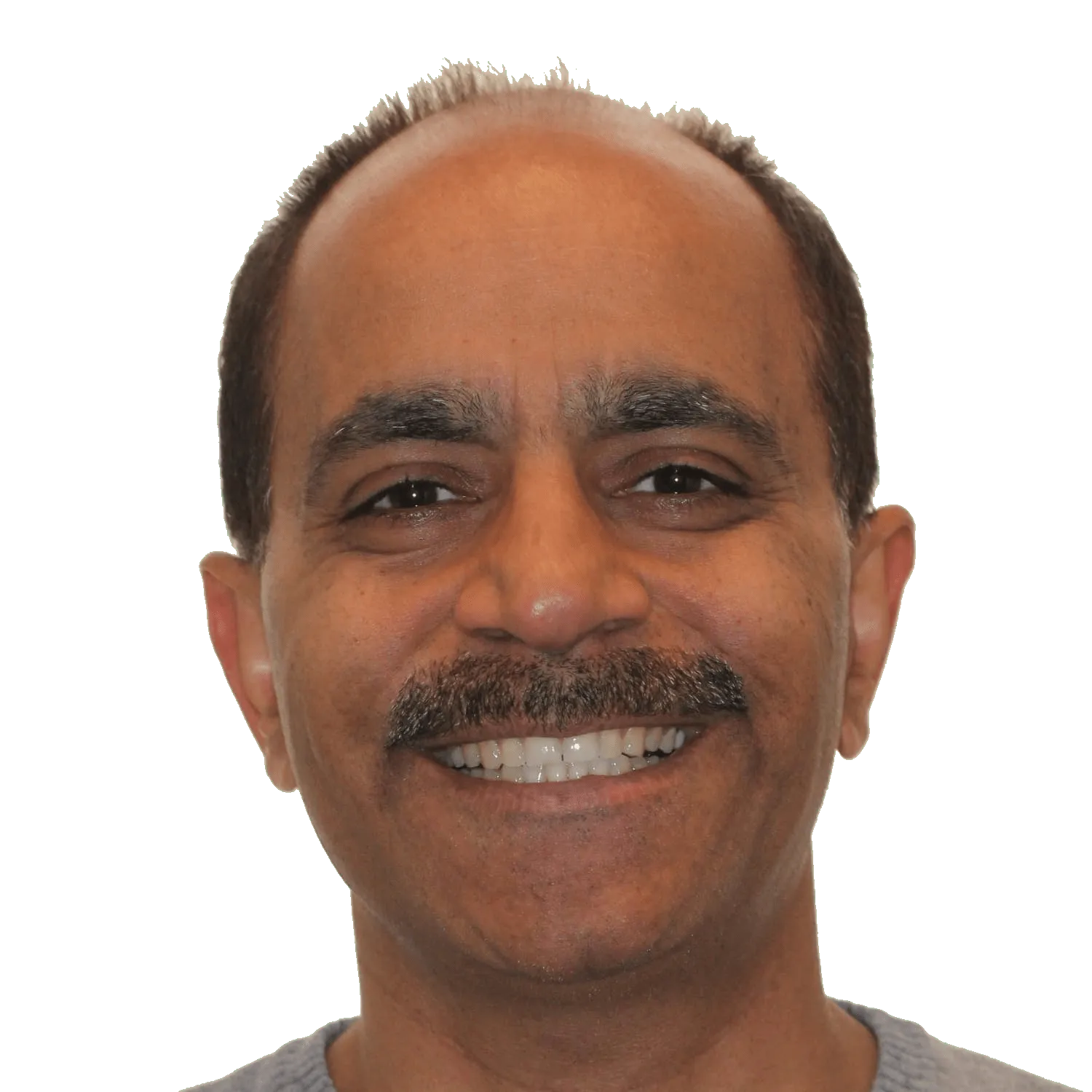 Middle-aged man with mustache smiling and wearing a gray shirt.