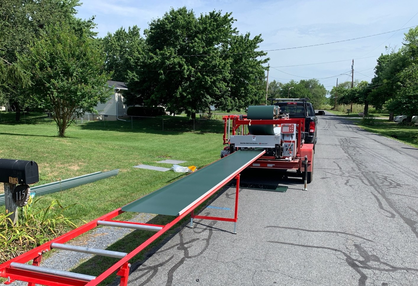 portable standing seam panel machine running metal roof panels