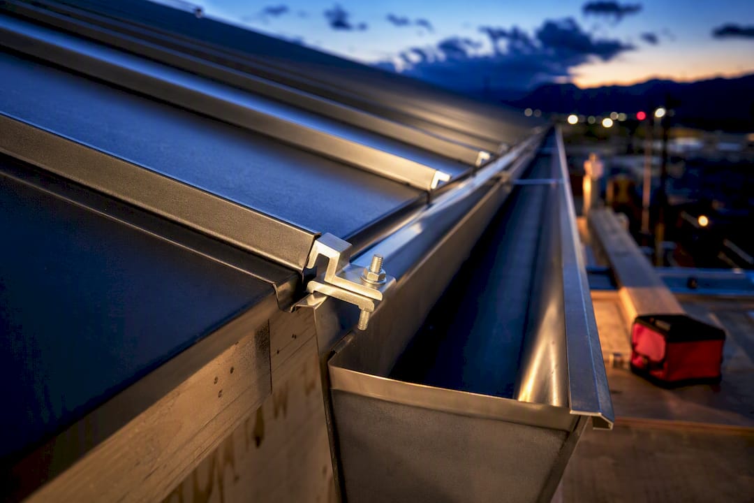 Match Gutters to Metal Panels to Keep the Warranty for Contractors