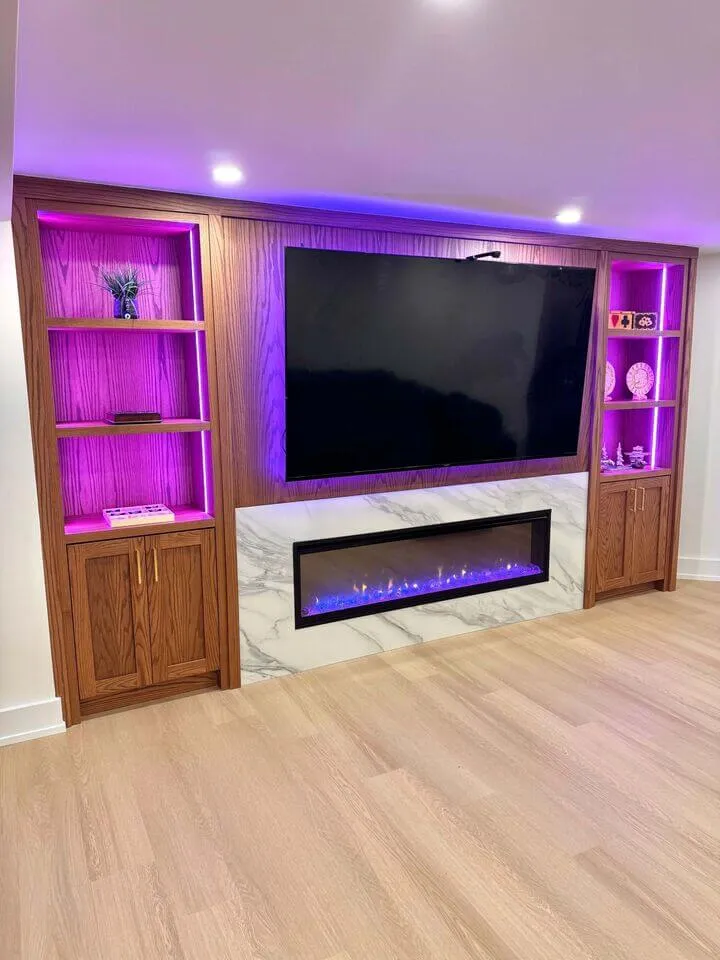 Basement media centre with wood panelling and purple accent lighting