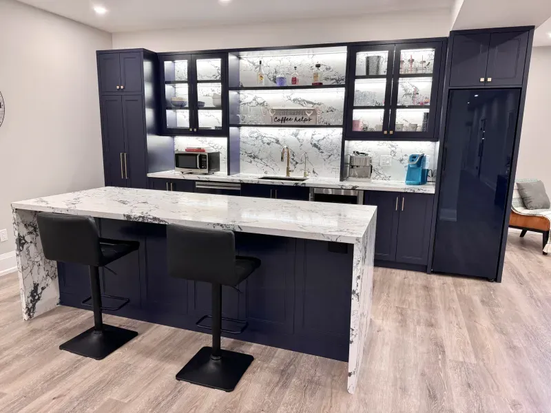 basement bar navy cabinets marble island