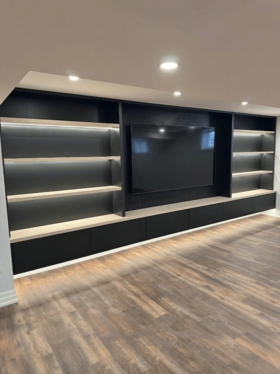 Basement finishing in Markham — black media unit with LED shelving in a Markham finished basement