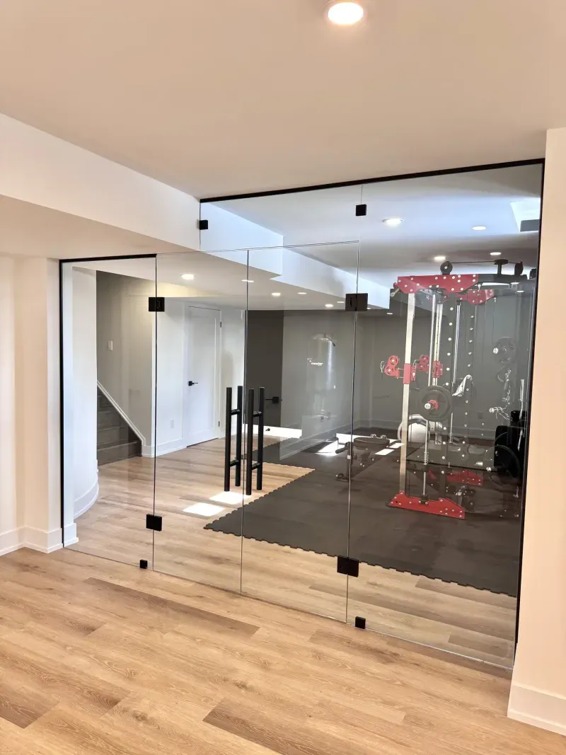 basement gym glass wall red equipment