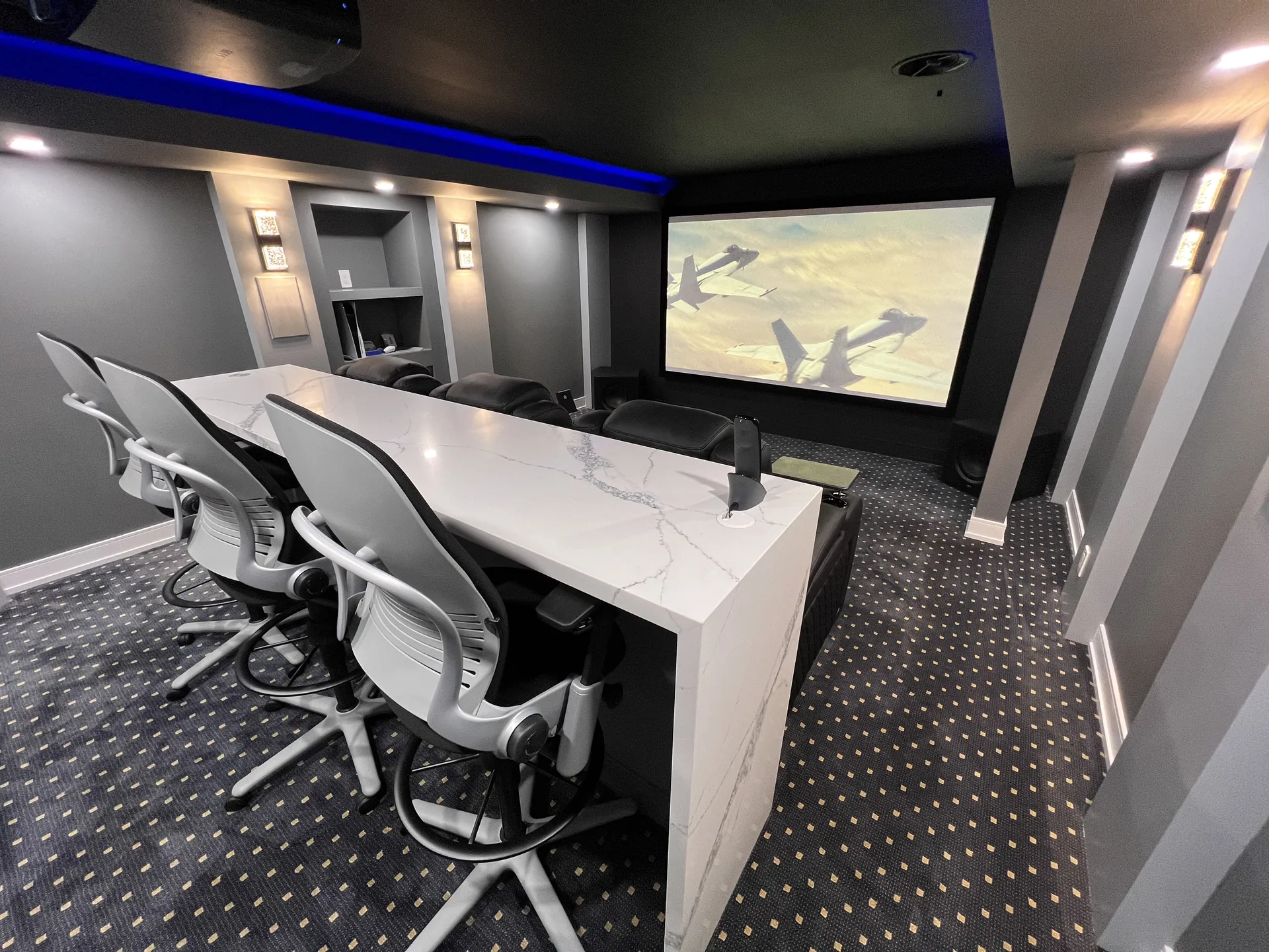 Basement finishing in King City — basement media room with projector screen and desk workstations