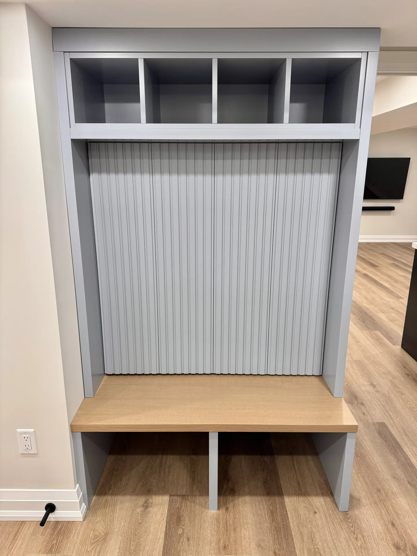 Home renovations in Oakville — custom basement mudroom bench and storage millwork