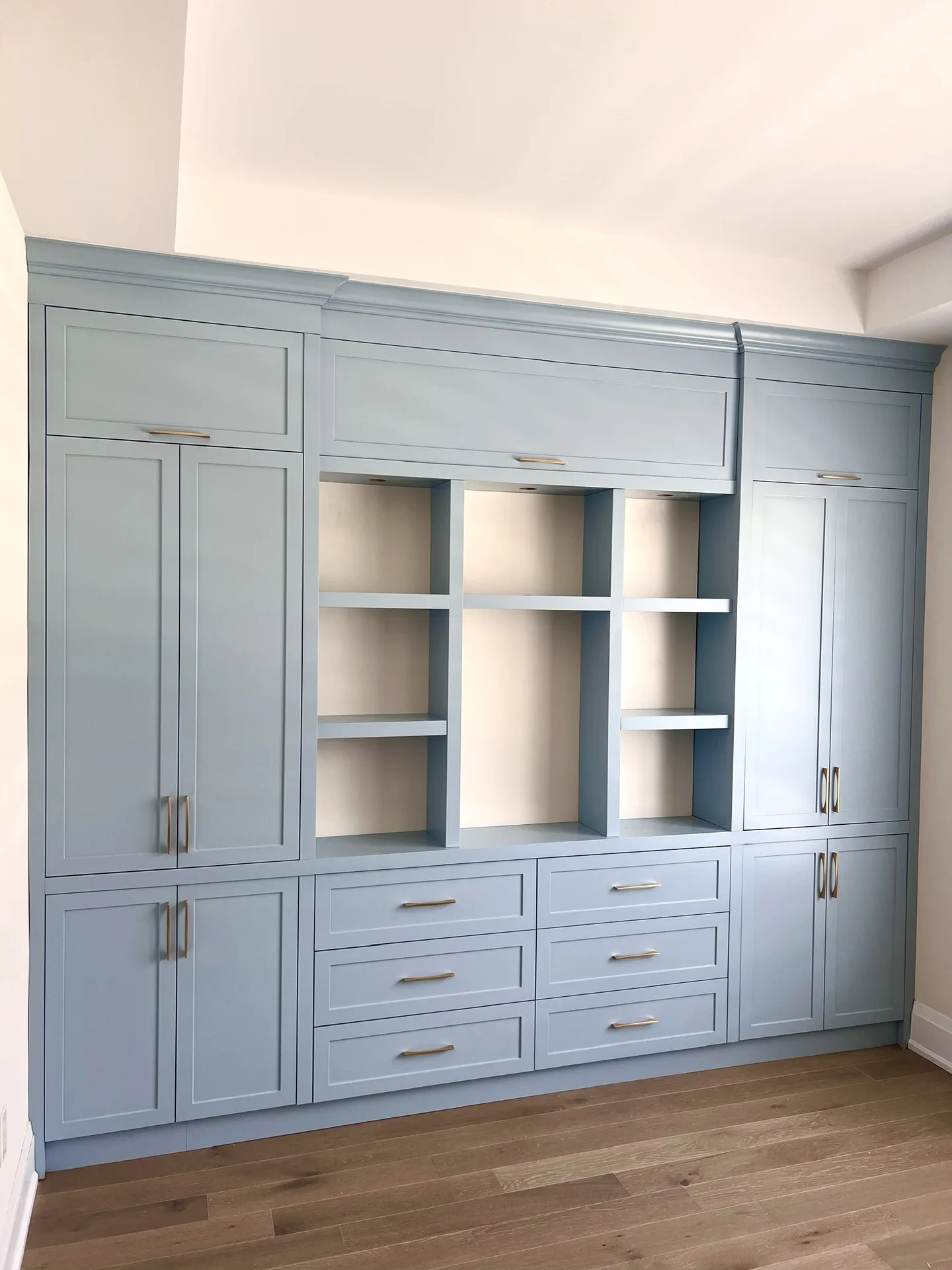 Home renovations in Pickering — blue built-in office cabinetry in a finished basement