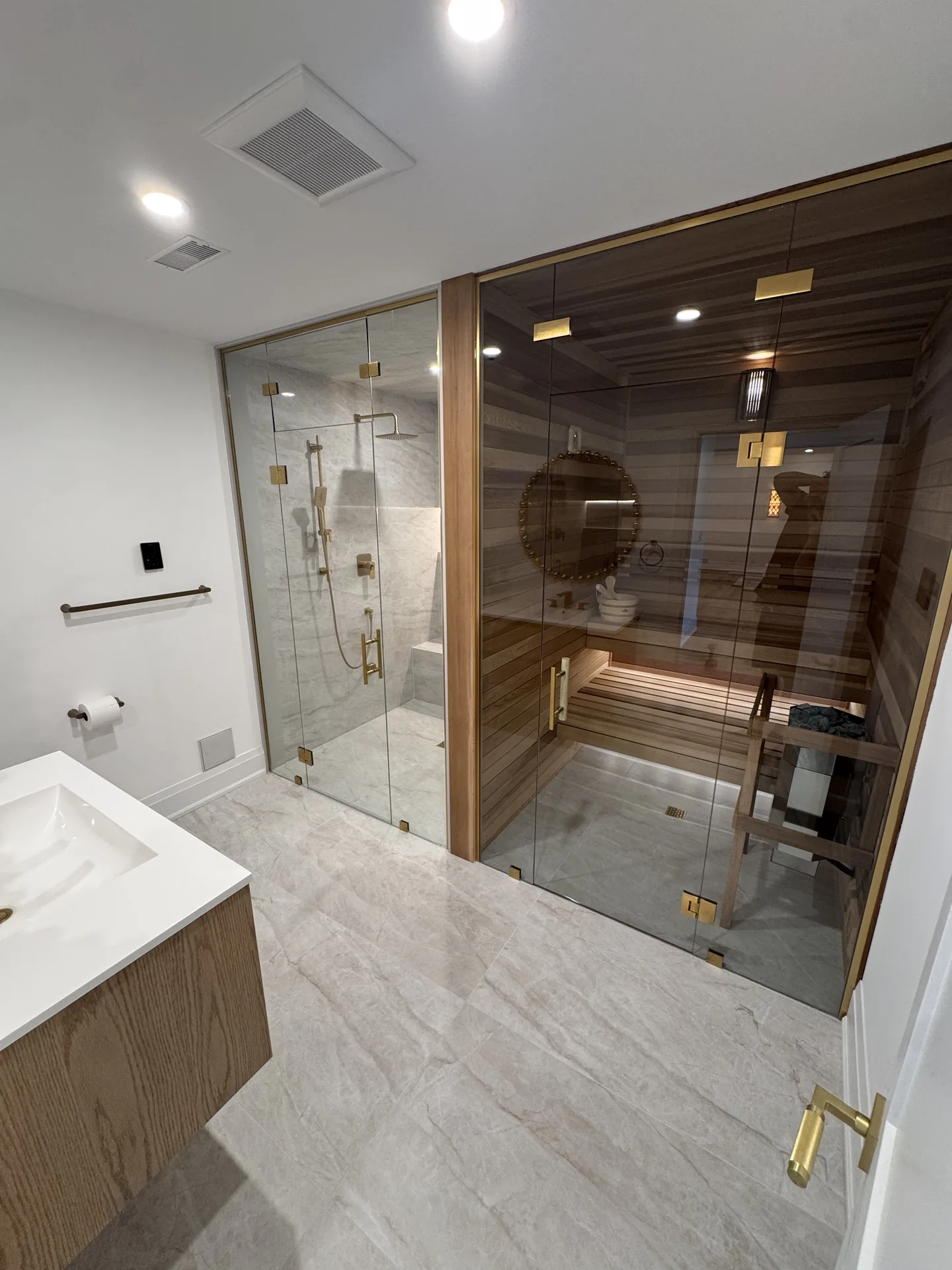 Structural work in Oakville — basement spa bathroom with marble finishes and sauna