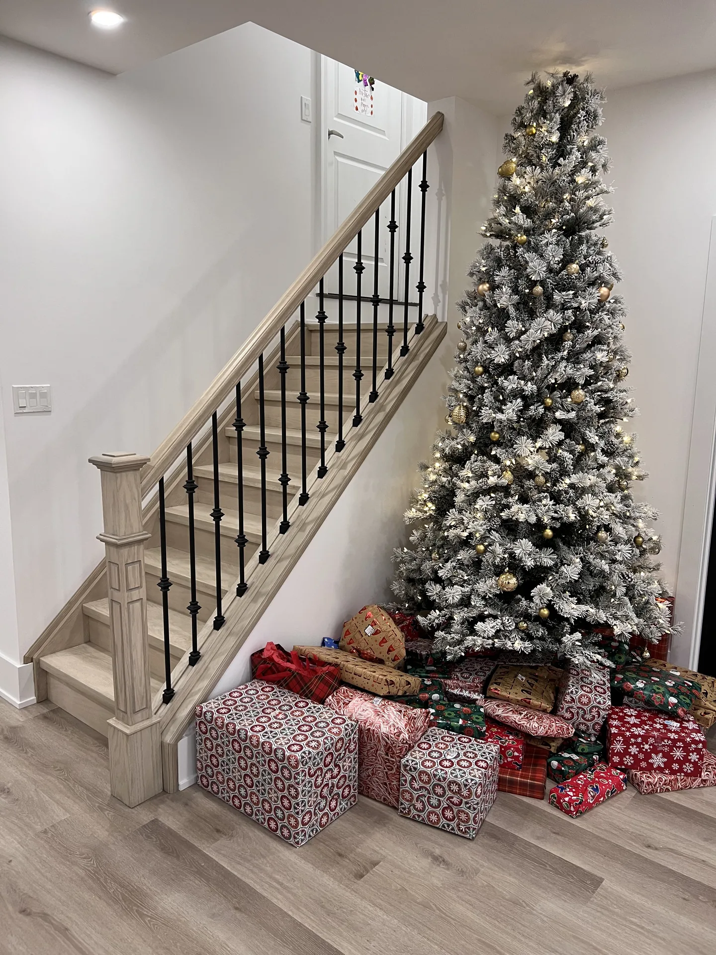 Structural work in Clarington — basement staircase with white and black spindle railing