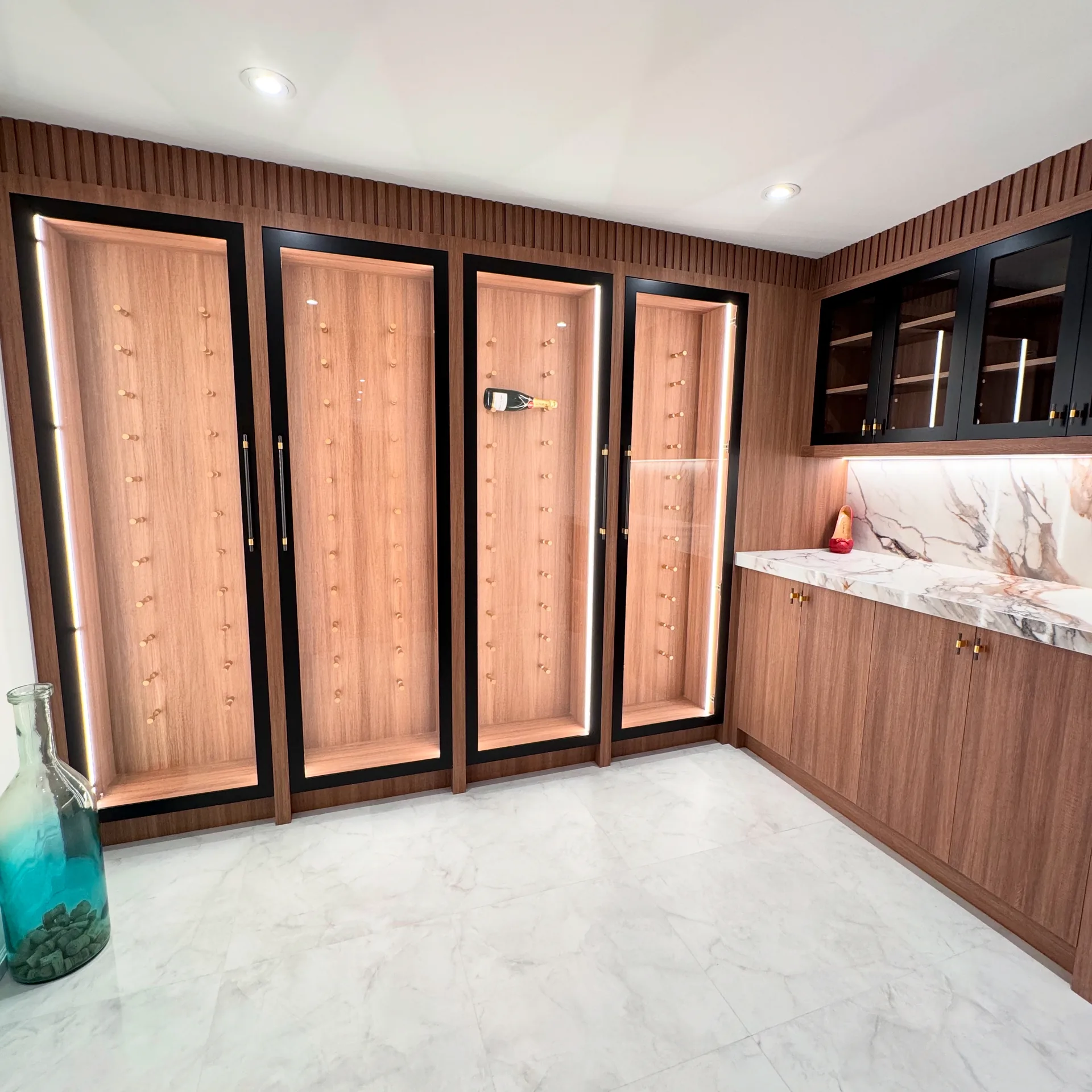 Home renovations in Whitby — walnut wine cellar and humidor cabinets in a finished basement