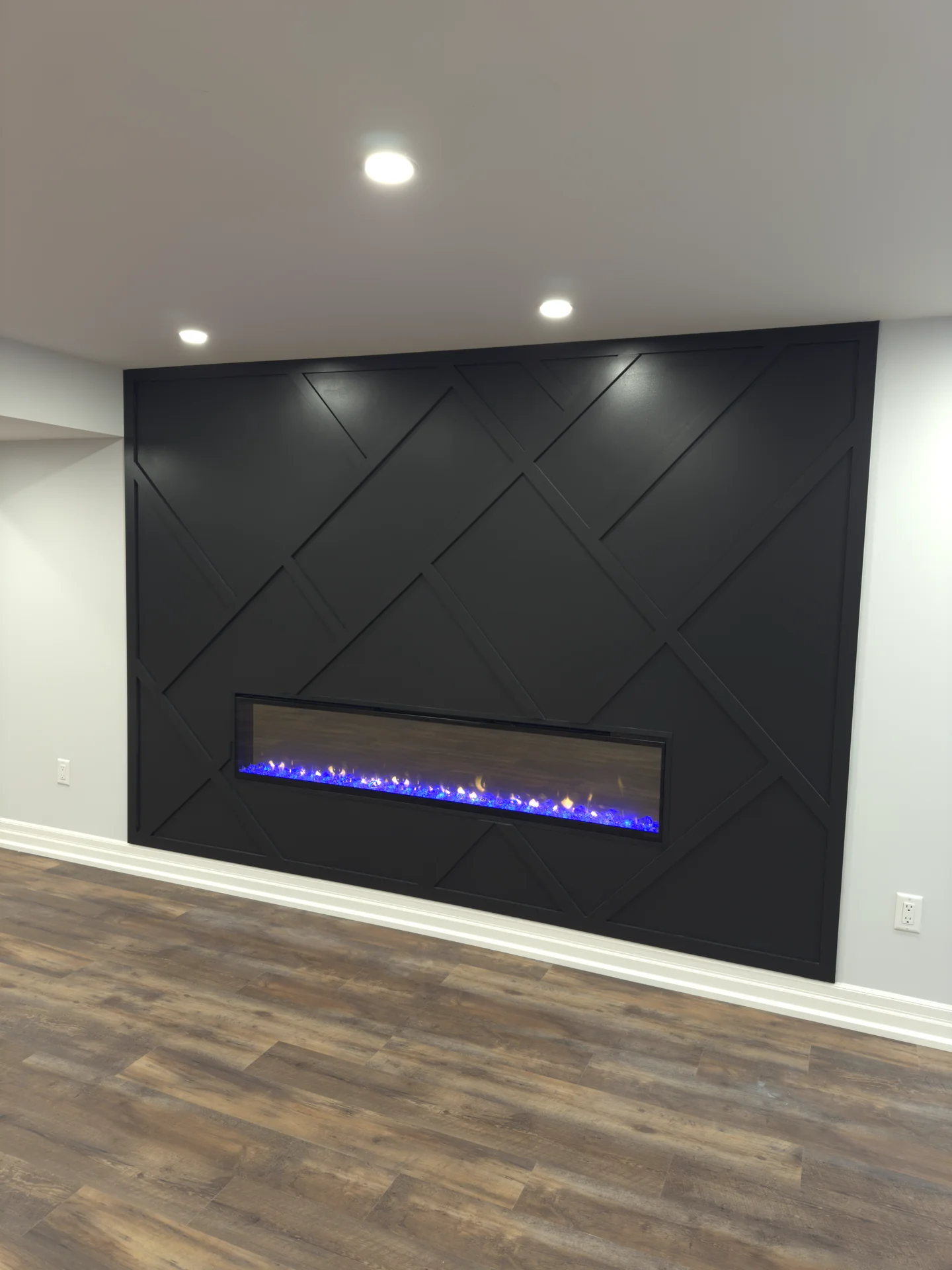 basement dark feature wall linear fireplace