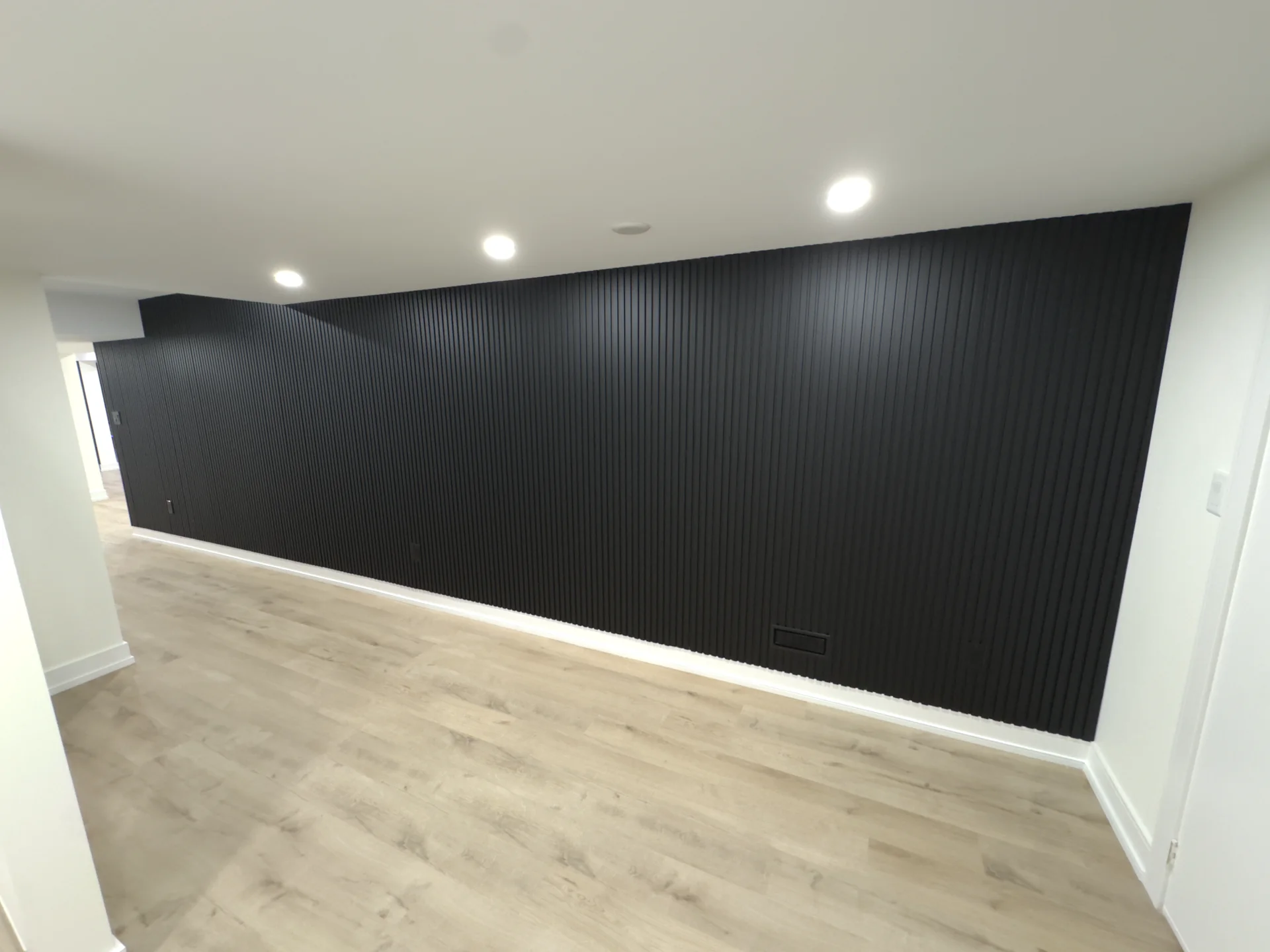 basement black slat accent wall media room