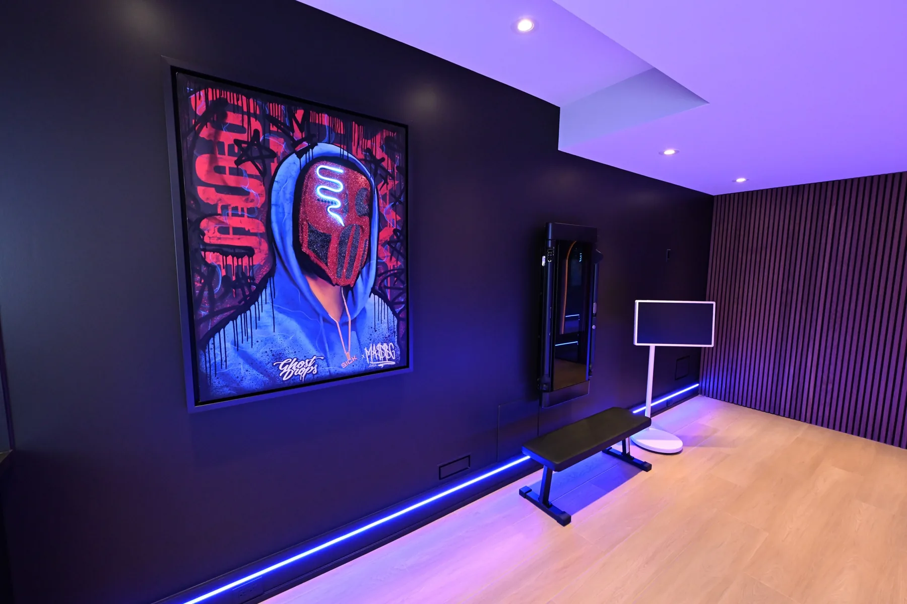 Gallery wall with artwork at the studio entrance