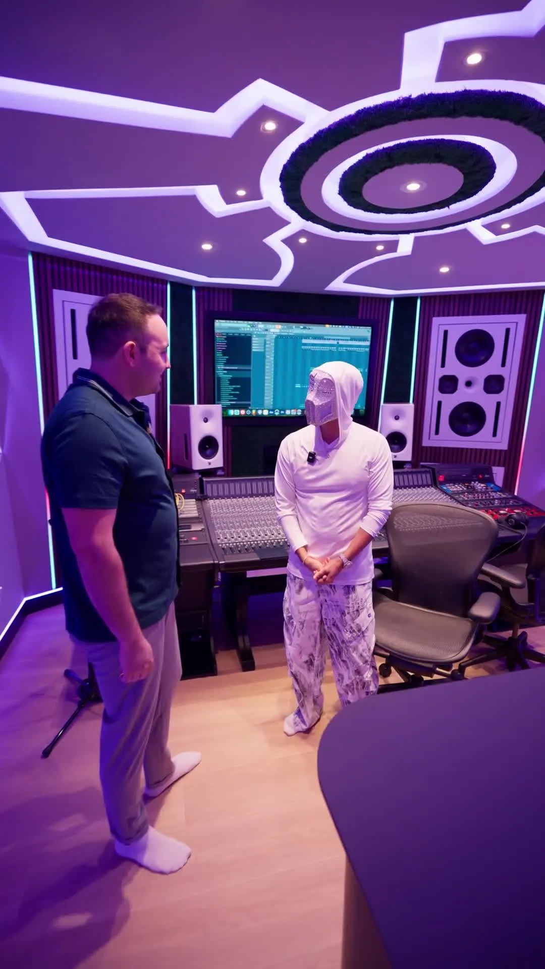 Kam Oveisy, President of Desire Basements, at the console inside Sickick Studio