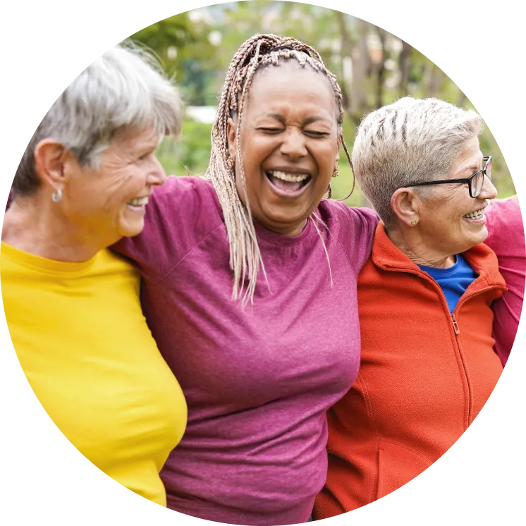 Three happy hugging older women in workout clothes cropped in a circle