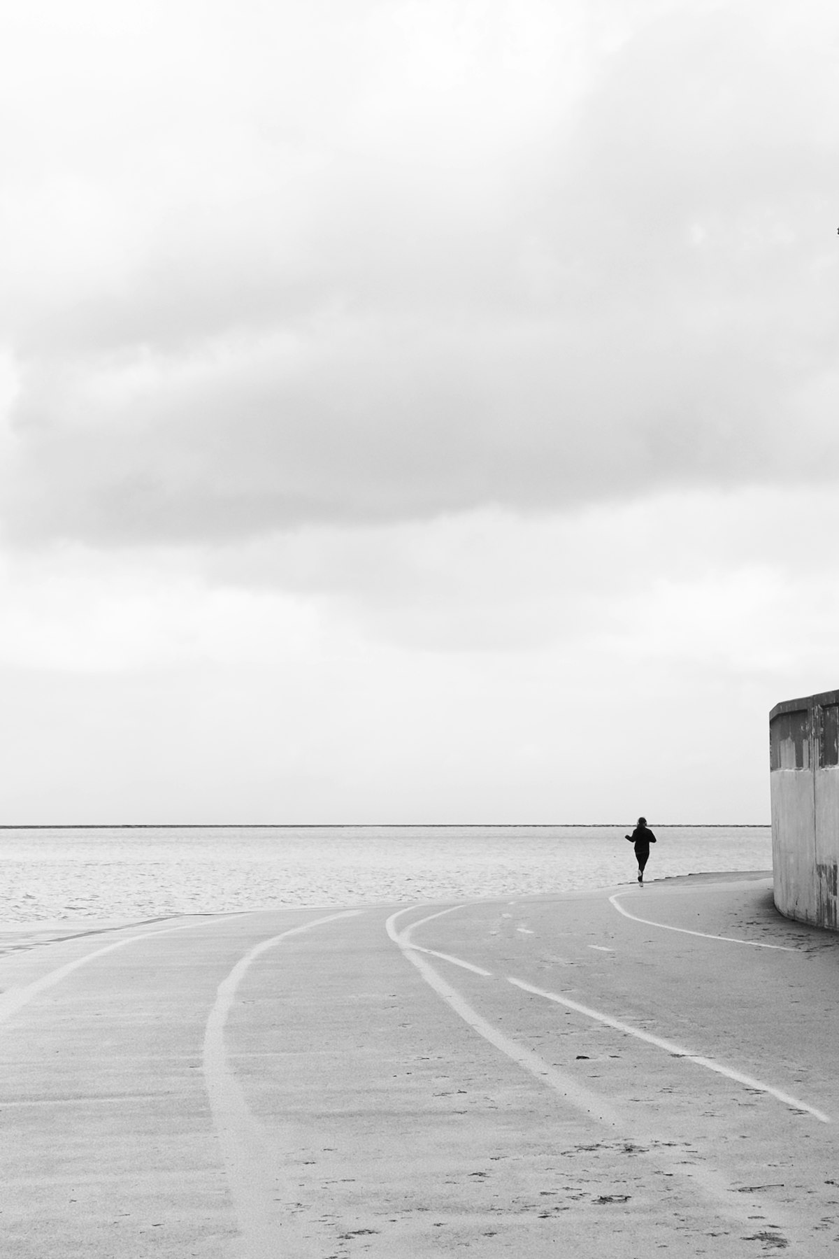 Person running along a coastal path