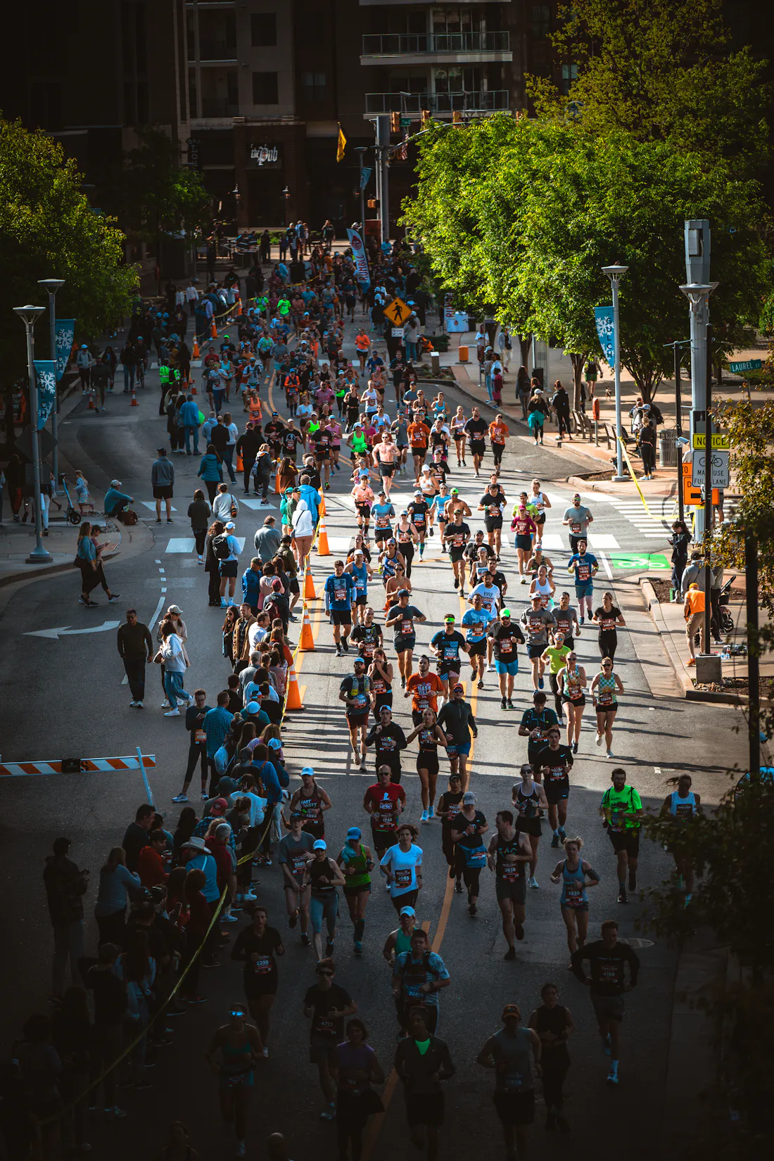 Runners filling a closed city street, evoking the Parramatta Half Marathon