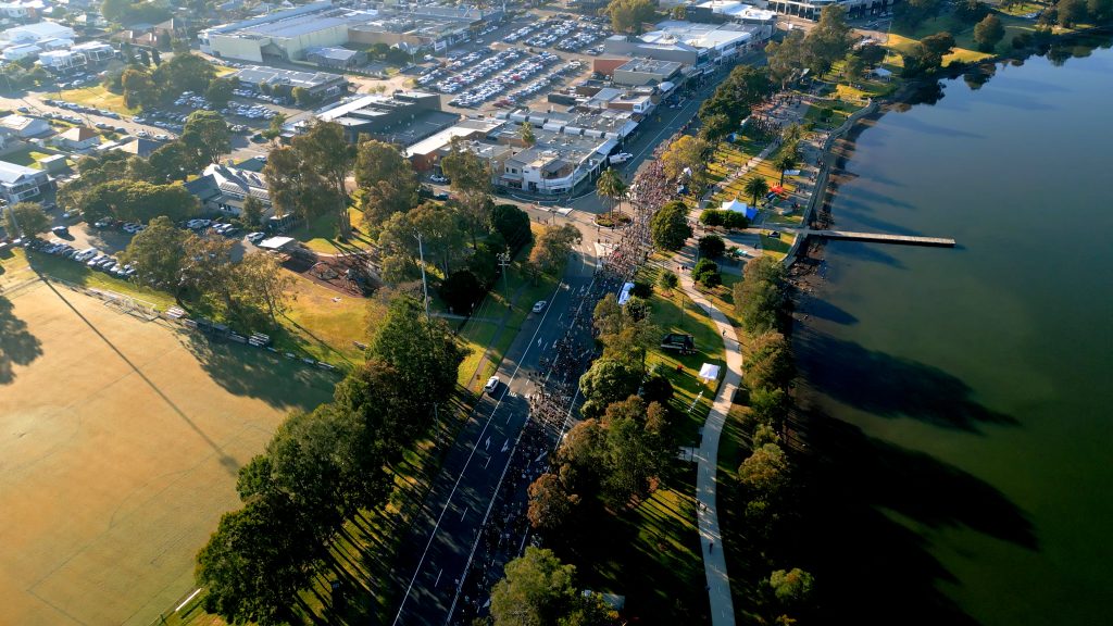 Runners by the water at the Lake Macquarie Running Festival