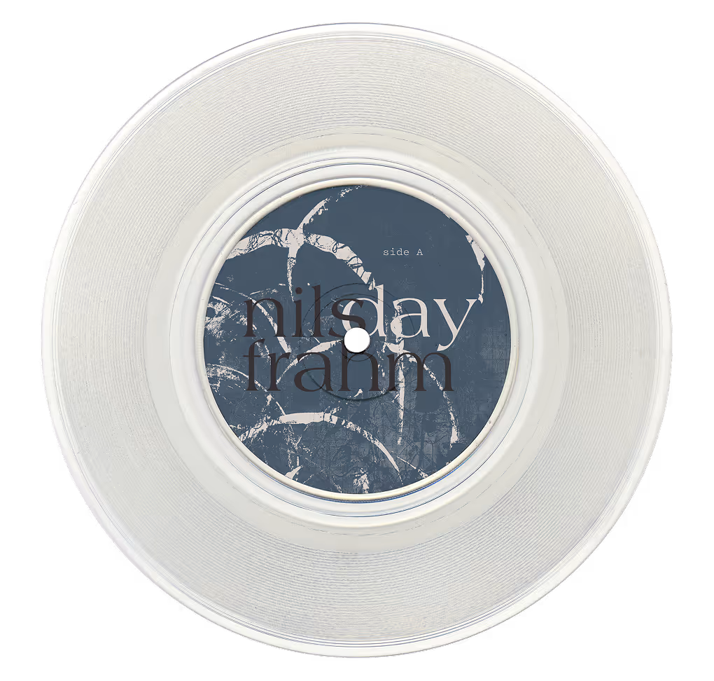 Clear vinyl record with a blue label inscribed with 'nils frahm' and 'side A'. (unblast.com)