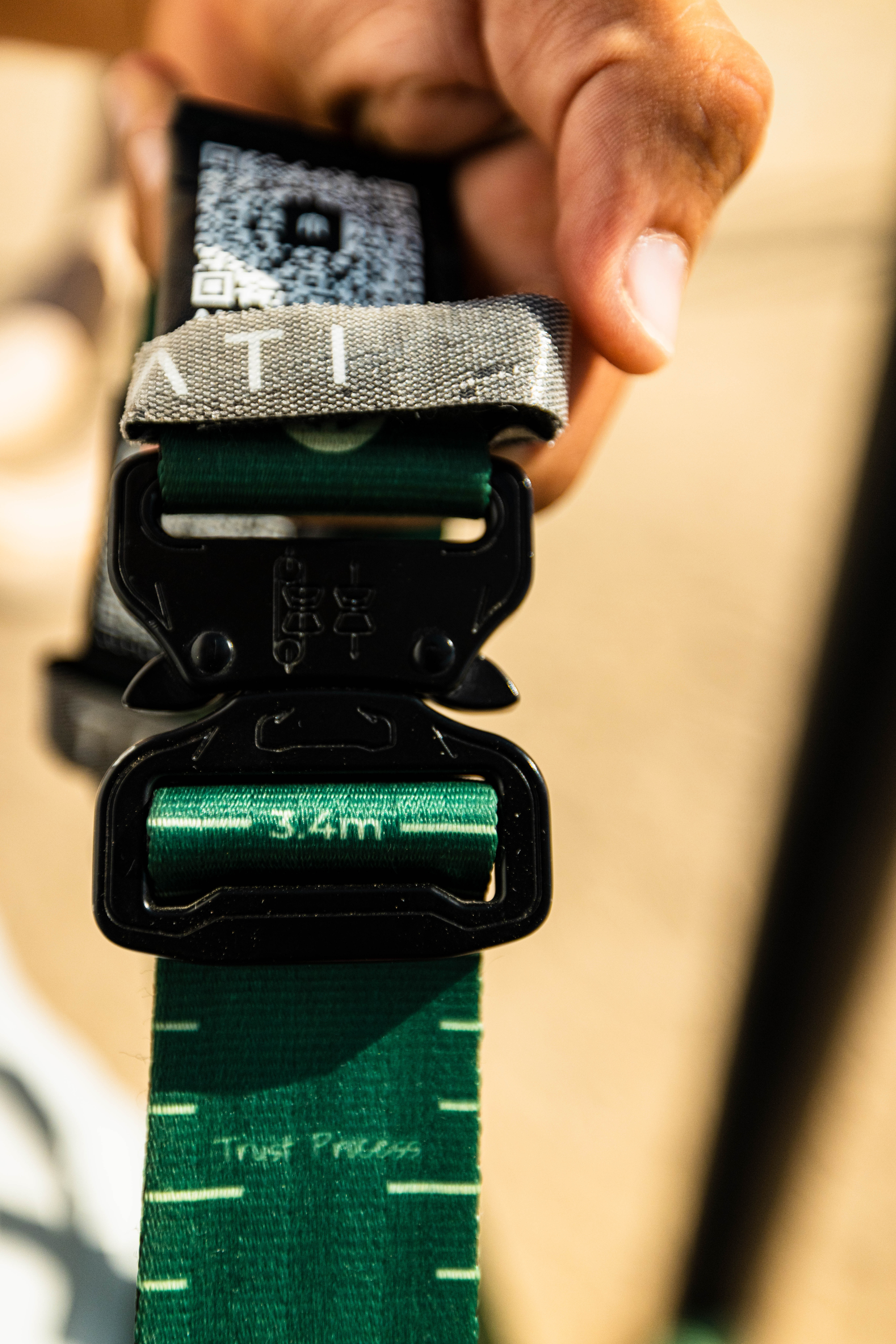 Metric scale markings on gymnastic ring strap showing centimetre-precision height adjustment